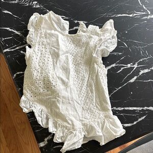 Asymmetrical eyelet top
